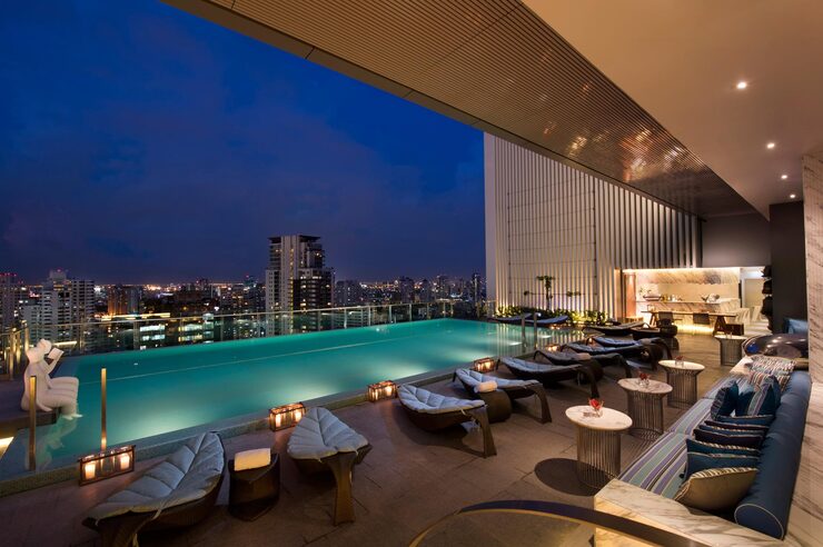 Rooftop swimming pool at dusk - Kolte Patil Sinhagad Road